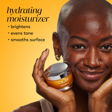 Model posing with Vitamin C Lightweight Hydrating Moisturizer jar in hand. Hydrating Moisturizer brightens, evens tone, smooths surface