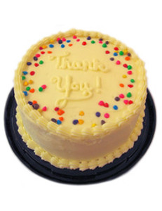 round cake with white frosting and colorful sprinkles around the edge round cake with white frosting and colorful sprinkles around the edge
