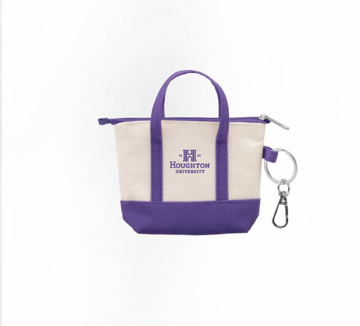 Mini canvas tote bag keychain with purple accents and has the Houghton University logo printed on the bag center in purple.