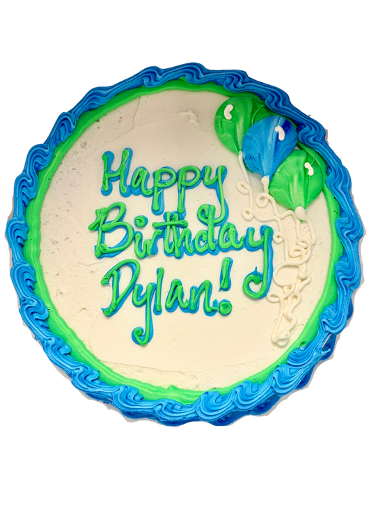 round cake with white frosting and blue and green border and balloons. Cake says "Happy Birthday, Dylan!"