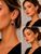 Clip earrings- Red hanging hearts with gold outline