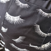 Detail of 6 pockets on lash print scrub jogger pants for lash salon use
