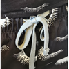 Details of elastic draw string waist on lash print scrub jogger pants for lash salon use.