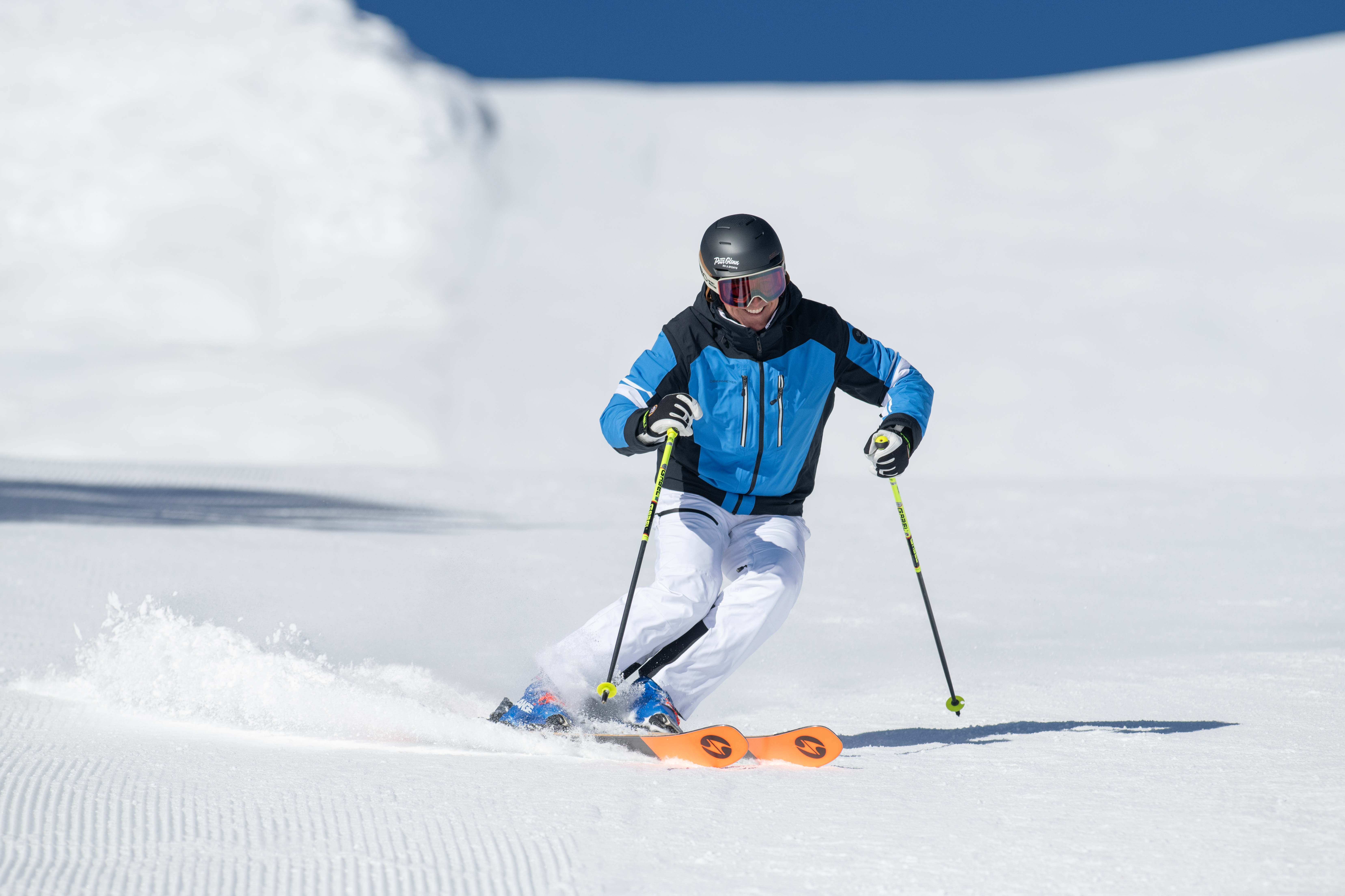 man skiing down mountain