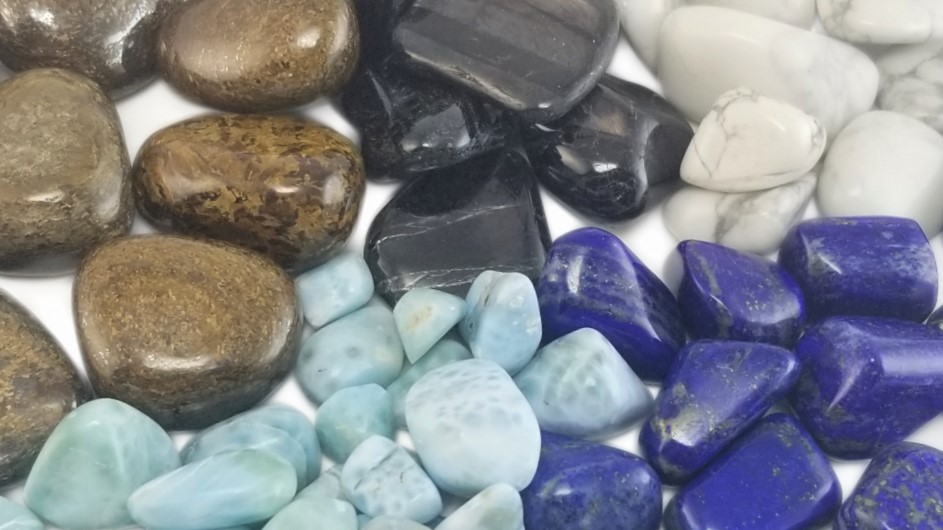 Tumbled crystals for Hanukkah in a radial pattern, including Bronzite, Howlite, Hypersthene, Lapis Lazuli, and Larimar.