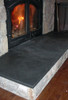 Honed black slate fireplace hearth.
