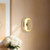 Pebble 8-in Glossy Black dimmable LED Wall Sconce - Metallic Brass