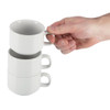 Hand holding Olympia Athena Stacking Cups 7oz with two cups being stacked.