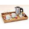 Two Olympia Athena Stacking Cups 7oz in a saucer with two glasses, kettle, and teaspoons on the side placed on a tray.