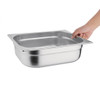 Vogue Stainless Steel 1/2 Gastronorm Pan 100mm in  hand.