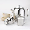 Olympia Concorde Stainless Steel Milk Jug 285ml with kettles, cups and saucers with content.