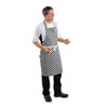 Side shot of man wearing Chef wearing Whites Bib Apron Black and White Check..