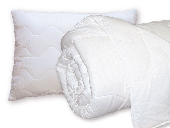 A White Pillow and White Double Duvet lined up next to each other
