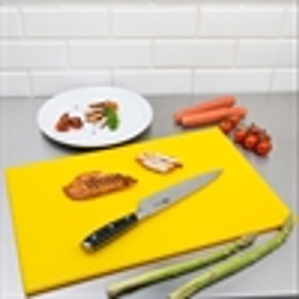 Full shot of Yellow Colour High Density Chopping Board with knife and vegetables.
