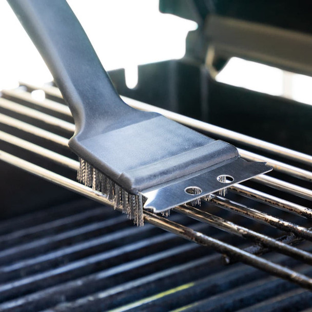 Full shot of Grill Brush with Scraper use in a griller.