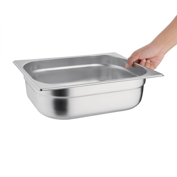 Vogue Stainless Steel 1/2 Gastronorm Pan 100mm in  hand.