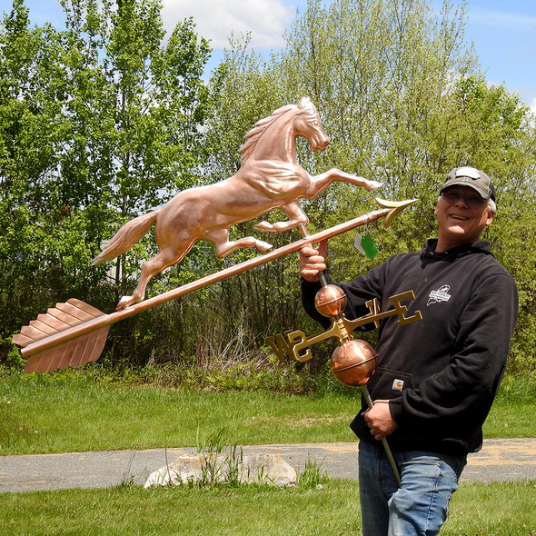 Todd holding Running Horse Weather Vane for Size Reference