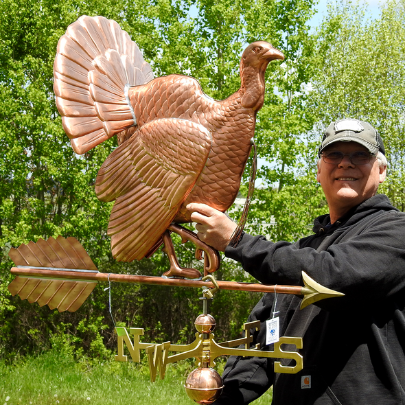 Todd holding Grand Turkey Weather Vane for Sizing Reference