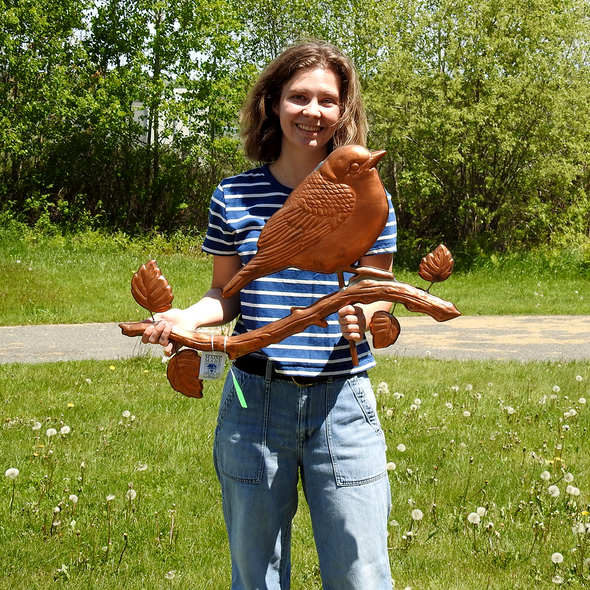 Riley holding Warbler Weather Vane For Size Reference