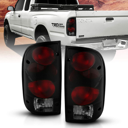 AmeriLite for 1995-2000 Toyota Tacoma Black Smoke Replacement Tail Lights w/Bulb Harness Set - Passenger and Driver Side.