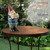 Alpine Corporation 12" Tall Garden Gnome Outdoor Yard Statue with Colorful Bird Accent, Playful Polyresin Decoration, Multicolor