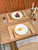 ANDSTAR Bamboo Placemats Set of 8, 17.7x11.8 Inch with Brown Fabric Border - Non-Slip & Heat Resistant, Stain-Resistant Japanese Style Table Mats for Dining Room, Kitchen Decor（Coffee）
