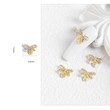 LAZO EN 3D CON DIAMANTES COLOR ORO PARA LAS UÑAS