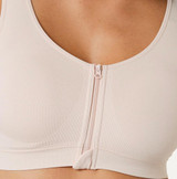 Beige seamless stretch bra with front closure, breathable anti-bacterial fabric, non-adjustable straps, and a comfortable A–D cup fit. Available in sizes S to XXXL.