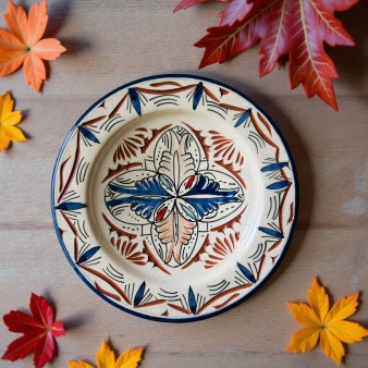 Glow and Clay Moroccan ceramic plate with ivory background and terracotta blue floral design