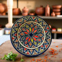 Artisan Moroccan dinnerware plate hand-painted in red, yellow, green, and navy Glow and Clay
