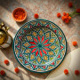 Glow and Clay Moroccan ceramic plate with red starburst mandala and multicolor geometric design