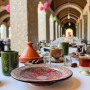 Decorative Moroccan pottery plate in red, black, and natural clay tones Glow and Clay