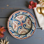 Artisan Moroccan pottery plate in ivory with hand-painted Mediterranean motifs Glow and Clay