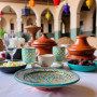 Handmade Moroccan pottery plate artisan dinnerware in red, blue, green, and orange