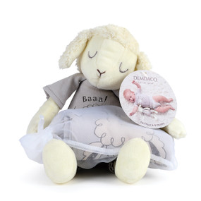 stuffed animal sheep with purple onesie rolled up inside drawstring bag on lap and tag reading Fits Most 6 to 9 Months