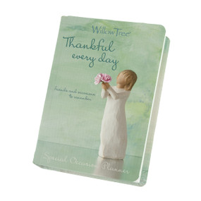 Green cover of planner reading "Thankful every day" with image of figure holding bouquet of pink flowers on front