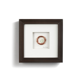 wire and seaglass depicting Robin's eggs in a nest with white background and dark frame