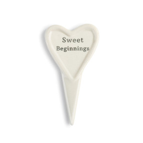 white ceramic heart with pointy stem reading Sweet Beginnings on front