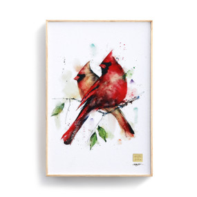 A white and wooden wall art piece with a pair of cardinals.