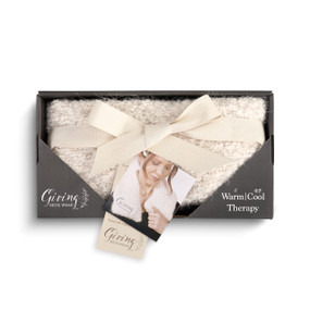 cream plush Giving neck wrap in black cardboard packaging wrapped in white ribbon