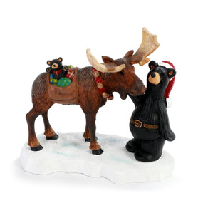 Figurine of a Santa black bear with a moose delivering Christmas gifts