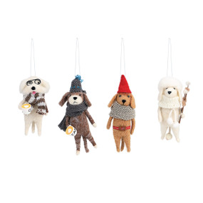four stuffed dog ornaments wearing different outfits