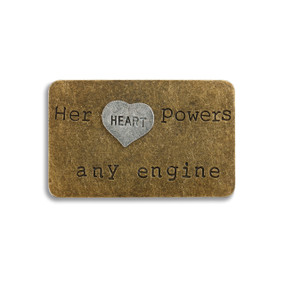 Small bronze rectangle pendant with 'her heart powers any engine' carved in