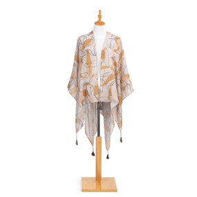 light orange silky pashmina with orange design and gray line drawings of abstract leaves and gray tassels on hem