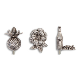 three silver knobs designed to be a pineapple, a flower, and a wine bottle with grapes