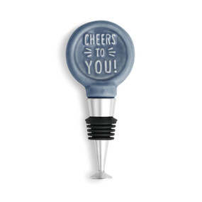 wine bottle stopper with blue glazed ceramic circle reading 'cheers to you!' on top