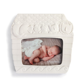 white ceramic photo frame shaped like Noah's Ark