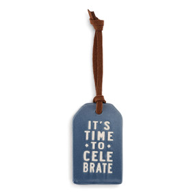 blue ceramic tag with leather hook reading It's Time to Celebrate