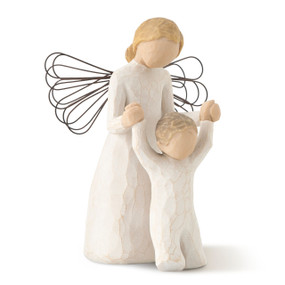 Front view of female angel figure in cream dress with wire wings, holding hands of toddlern in cream onesie walking in front of her