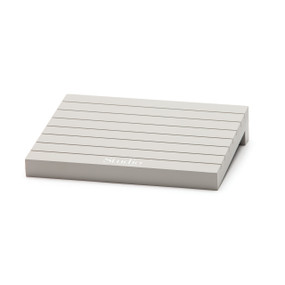 Light grey wooden block with lines on it